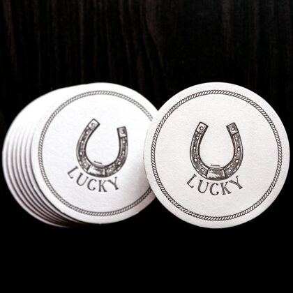 Set of 8 letterpress lucky u coasters